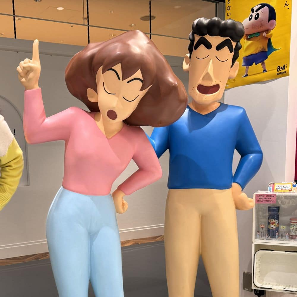 Life-sized statues of Misae and Hiroshi Nohara from Crayon Shin-chan inside the official store at Shinsaibashi PARCO in Osaka, Japan.