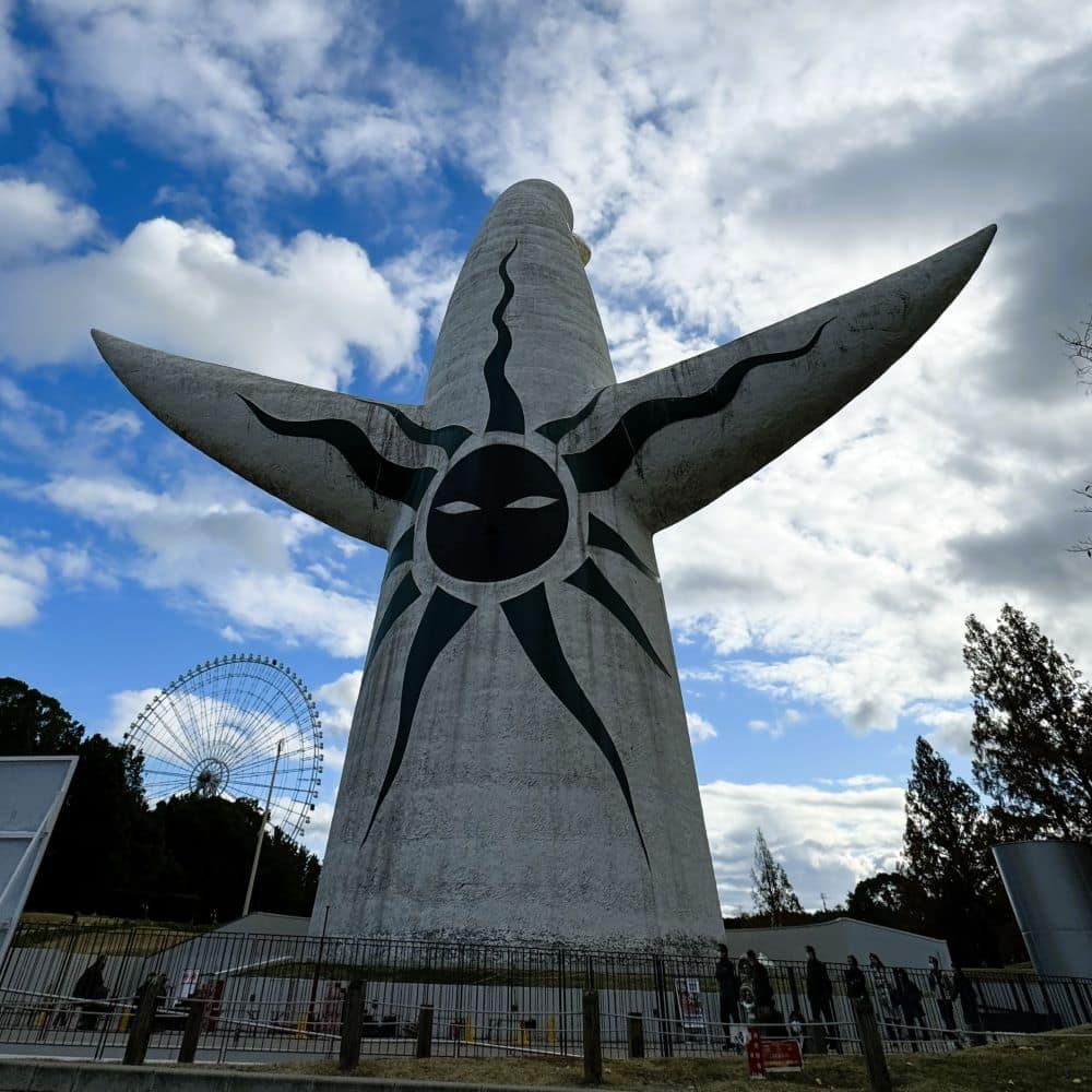 The back of Taro Okamoto’s Tower of the Sun sculpture featuring the black Sun of the Past face at Expo '70 Commemorative Park in Suita, Osaka, Japan.